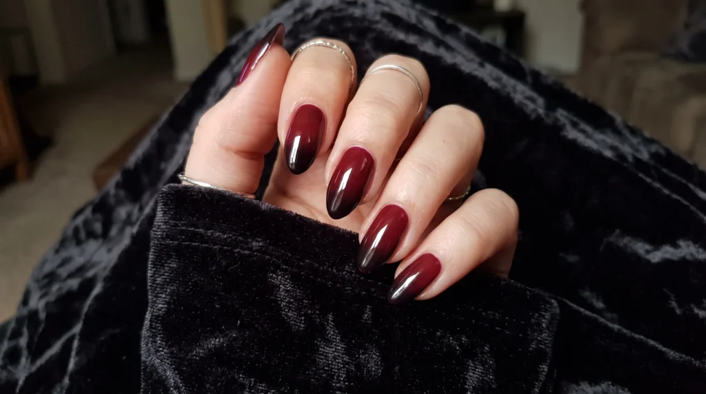 Short black cherry ombre nails fading smoothly from warm merlot to deep noir tips